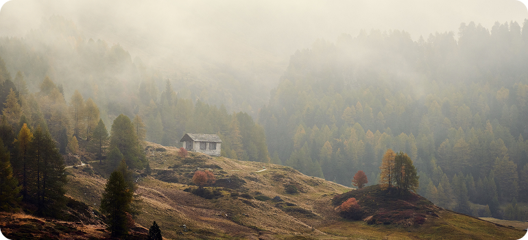 Traditional white house on hillside